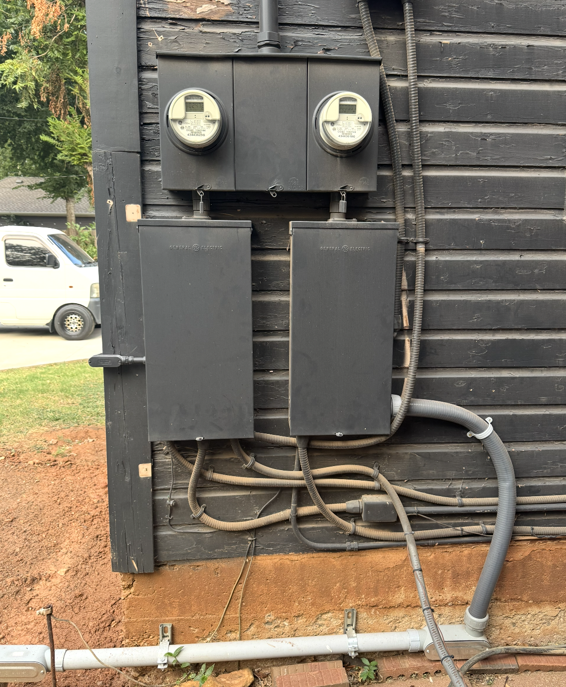 Main electrical panel — exterior meters and breaker boxes